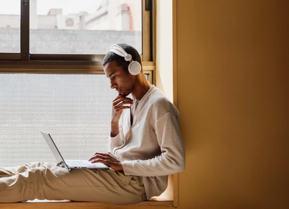 a person is sitting near the window